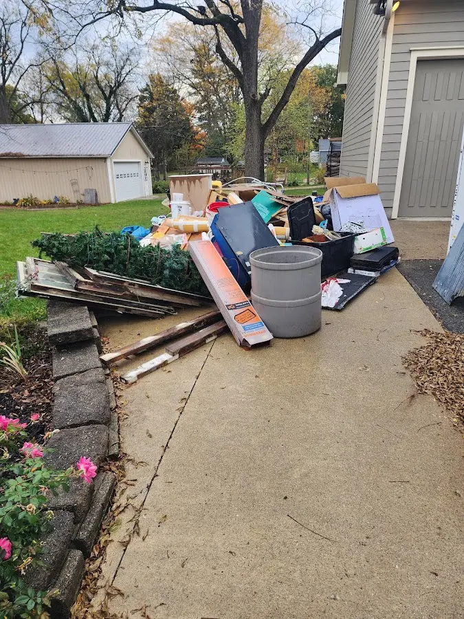 Dumpster being loaded with debris for Estate Cleanout Dumpster Rental in South Alamo